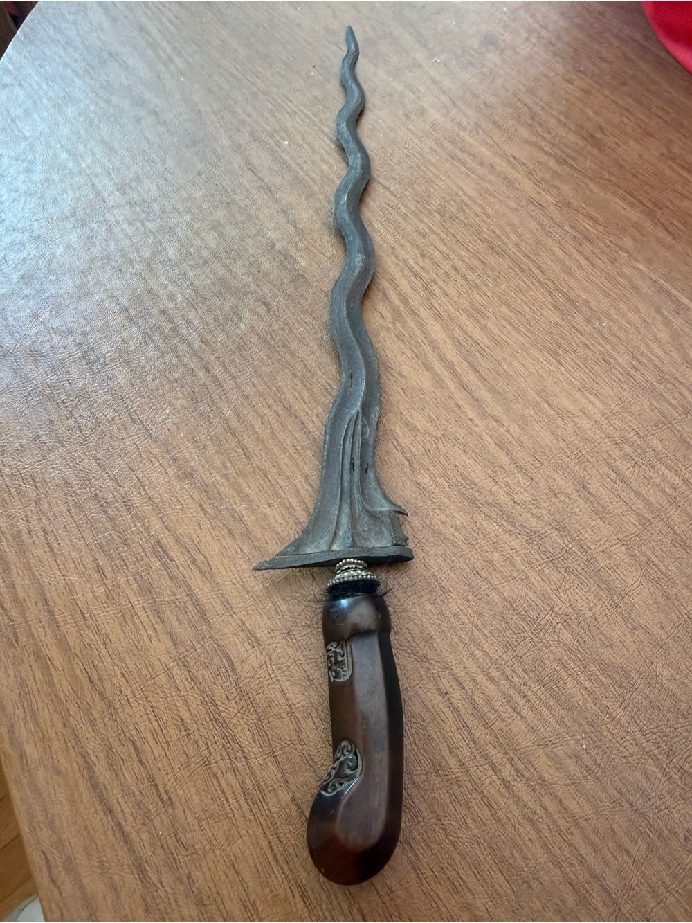 Antique Keris a traditional asymmetrical dagger with a wavy blade from Indonesia